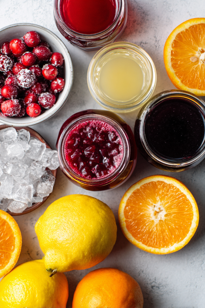 Christmas Pink Sugar Plum Punch ingredients on a clean surface