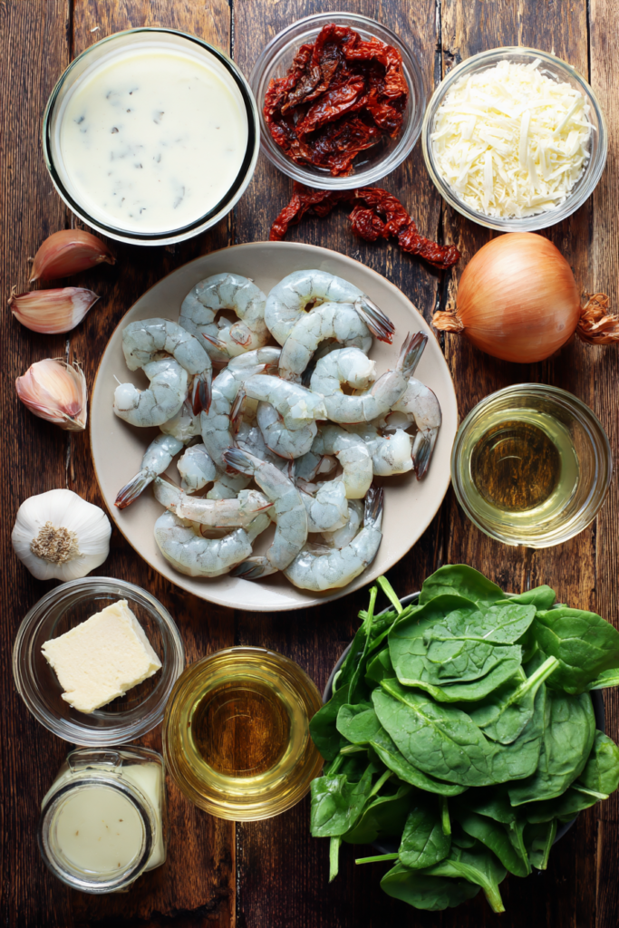Ingredients for Creamy Tuscan Shrimp Soup laid out on a counter